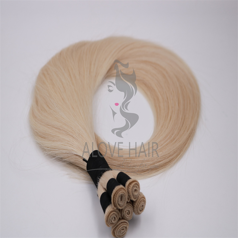Thin-knot-blonde-color-hand-tied-weft-extensions-for-extensiontraining.jpg